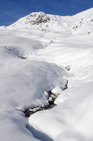 Mountain stream in winter in the ski resort of Le GrandBornand HauteSavoie France
