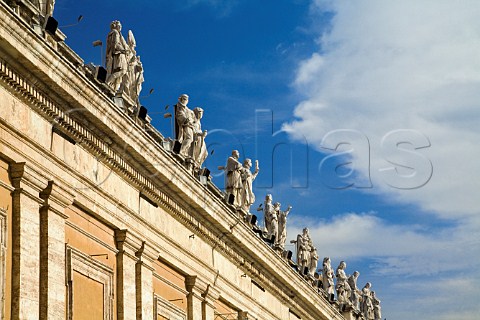 Statues on the roof of St Peters basilicaoverlooking Piazza San Pietro Vatican City Rome Italy