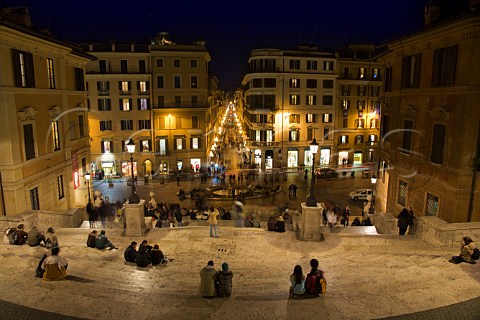 People gathering on the Spanish Steps at night Piazza di Spagna Rome Italy