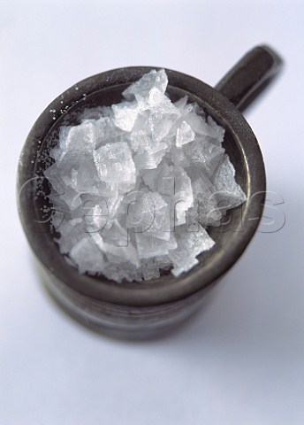A pewter tankard full of rock salt crystals
