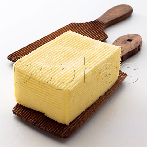 Butter pat on wooden paddles