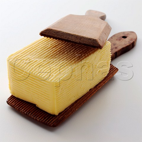 Pat of butter with wooden paddles