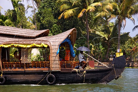 Houseboat cruising along the Kuttanad the backwaters of Kerala known as the Venice of the East Kerala India
