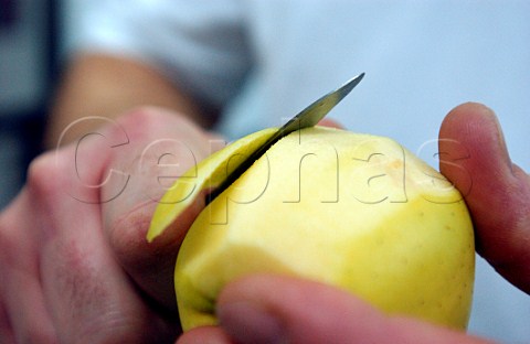 Peeling an apple with a knife