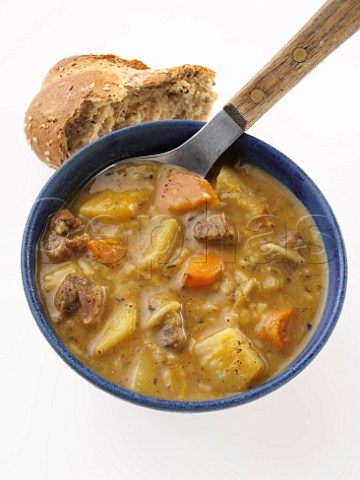 Pumpkin and lamb soup with a brown bread roll
