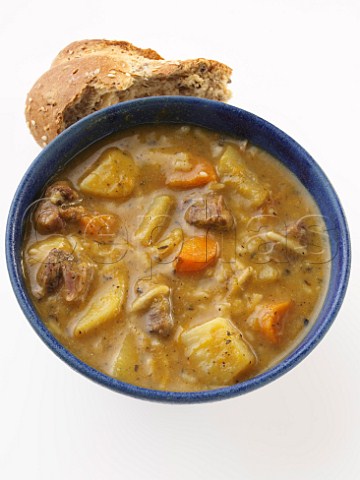 Pumpkin and lamb soup with brown bread rolls