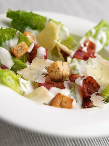 Crispy bacon and croutons in Caesar salad