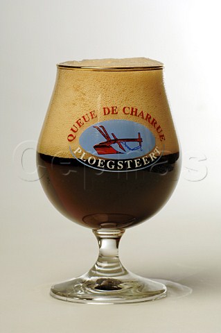 Glass of Queue de Charruge Ploegsteert beer Belgium