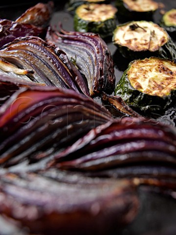 Roasted red onions and courgettes