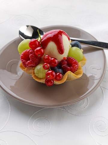 Summer fruits with vanilla icecream in a wafer basket