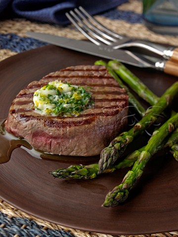 Fillet steak with grilled asparagus and herb garlic butter