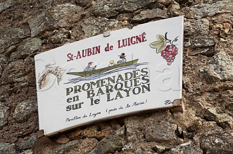 Sign on old windmill advertising boat trips on the Layon River at StAubindeLuign MaineetLoire France Coteaux du Layon