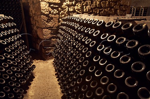 Bottles of sparkling wine in pupitres in the cellars of LangloisChteau at SteHilaireSteFlorent near Saumur MaineetLoire France Crmant de Loire