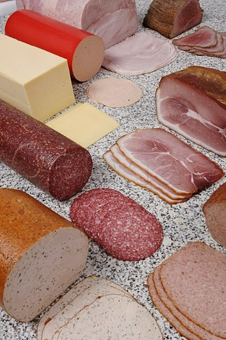 Selection of sliced hams salami and cheese