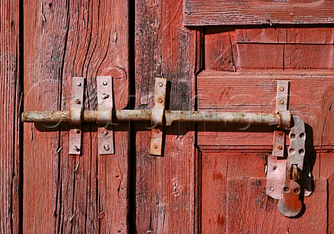 Rusty bolt on old wooden door