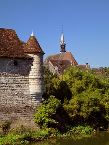 StMartin Collegiate Church viewed over the Serein River in Chablis Yonne France