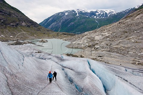 Hikers on Tunsbergsdals Glacier Leirdal Norway