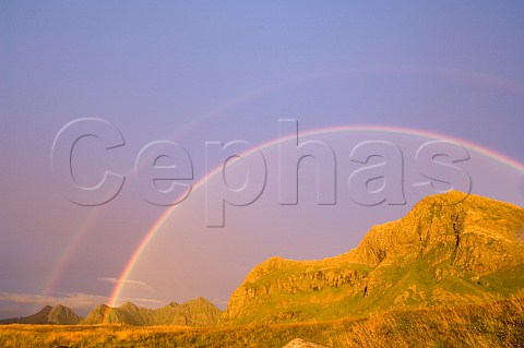 Double rainbow at sunset Lofoten Islands Norway