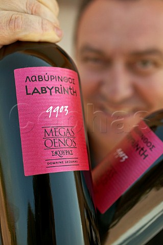 George Skouras holding bottles of Domaine Skouras wine Argos Greece Nemea