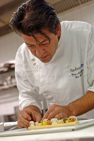 Yves Mattagne 2 star Michelin arranging food on a plate