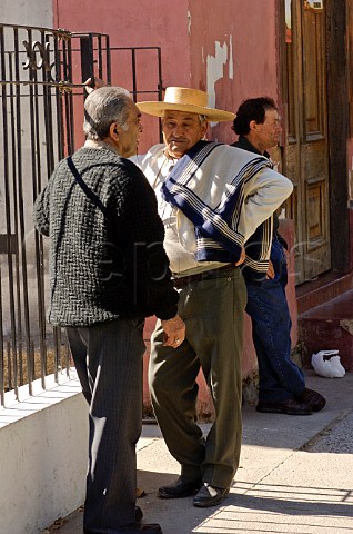 Men talking in street Peralillo Colchagua Valley Chile