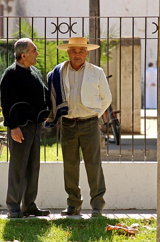 Men talking in street Peralillo Colchagua Valley Chile