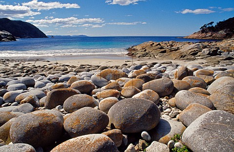 Boulders on beach at Bluestone Bay Freycinet National Park Tasmania Australia