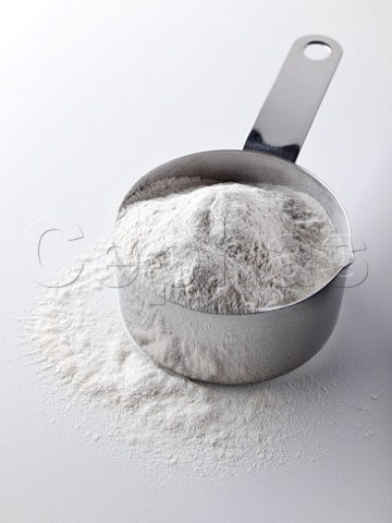 Steel measuring cup of self raising flour