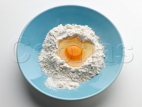 Egg and flour in a mixing bowl