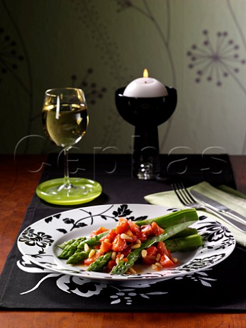 Asparagus and tomato salad with pinenuts