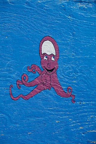 Painting of octopus on fishing boat in Favignana harbour Favignana Island Sicily Italy