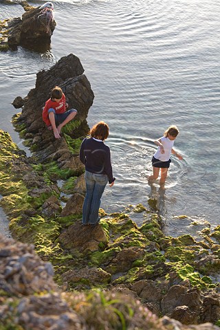Family relaxing at Cala Rossa Red Cove Favignana Island Sicily Italy