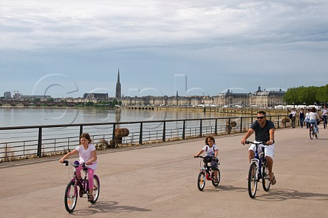 Cyclists on the promenade by the Garonne river Bordeaux Gironde France