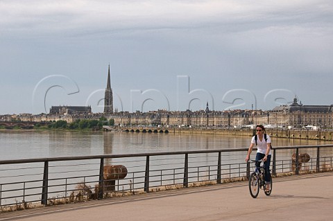 Cyclist on the promenade by the Garonne river Bordeaux Gironde France