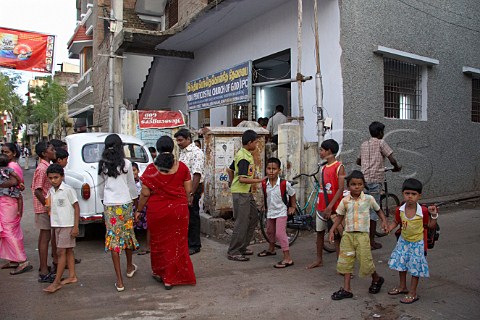 Locals outside the India Pentecostal Church of God IPC Thiruvalluvar Nagar Ayanavaram Chennai Madras India