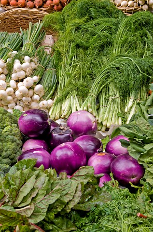 Aubergines fennel and onions on market stall