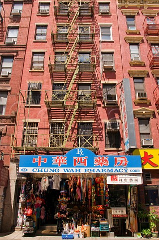 Typical Manhattan apartment blocks with external steel fire escapes Chinatown New York USA