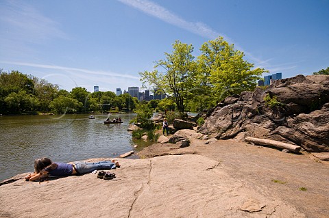 People enjoying the sunshine in Central Park New York USA