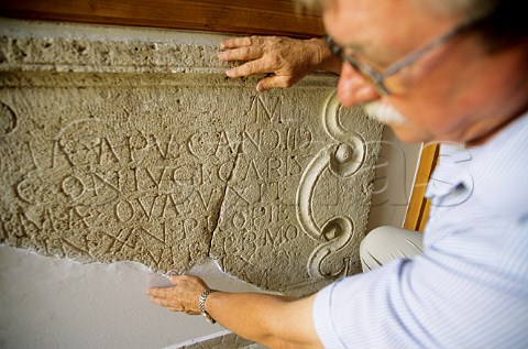 Ede Tiffan of Tiffans Winery with old Roman stone inscription Villany Hungary Villany