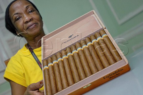 Female worker with box of Cohiba Esplendidos cigars  Havana Cuba