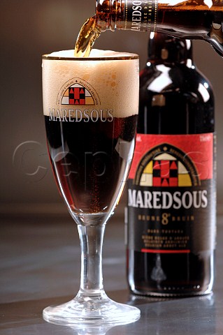 Pouring glass of Maredsous Belgian beer