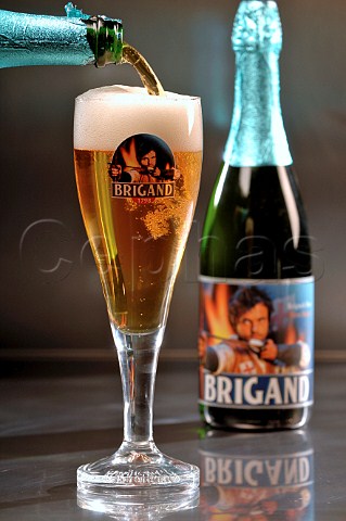 Pouring glass of Brigand Belgian beer