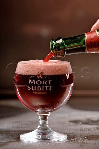 Pouring glass of Mort Subite Belgian beer