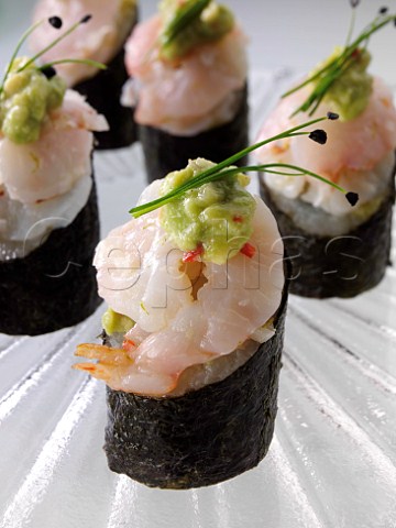 Ceviche with prawn on a sushi rice cake with avocado salsa
