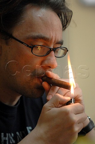 Lighting a Cuban cigar