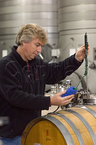 Winemaker Laurent Montalieu measuring the temperature during malolactic fermentation at Solna Cellars  McMinnville Oregon USA  Willamette Valley