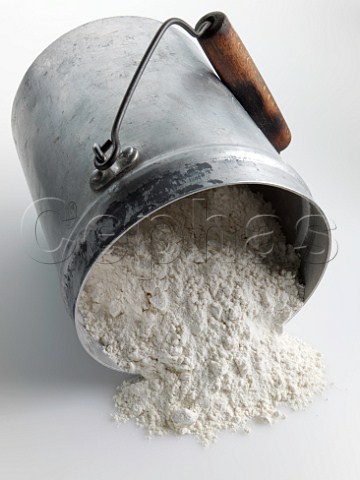 Flour spilling from an old tin container