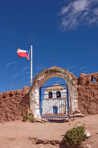 Machuca village church with Chilean flag  at over 4000 metres altitude in the Atacama Desert Chile