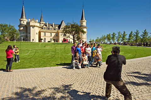 Tourists being photographed in front of Chateau building at Chateau Changyu AFIP Global winery Ju Gezhuang Beijing Miyun County China