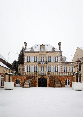 Snow falling on the house of Bollinger at Ay Marne France  Champagne